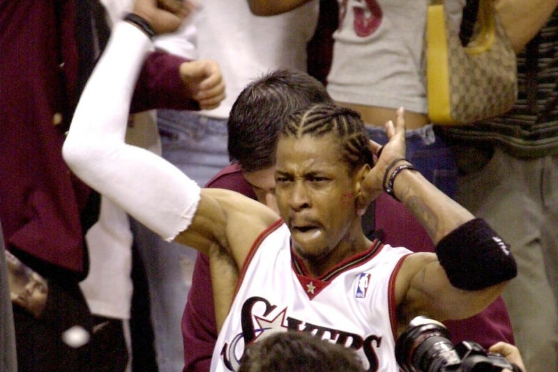 The Sixers' Allen Iverson celebrates in the crowd after the Sixers beat the Toronto Raptors in game seven of their series on Sunday, May 20, 2001.