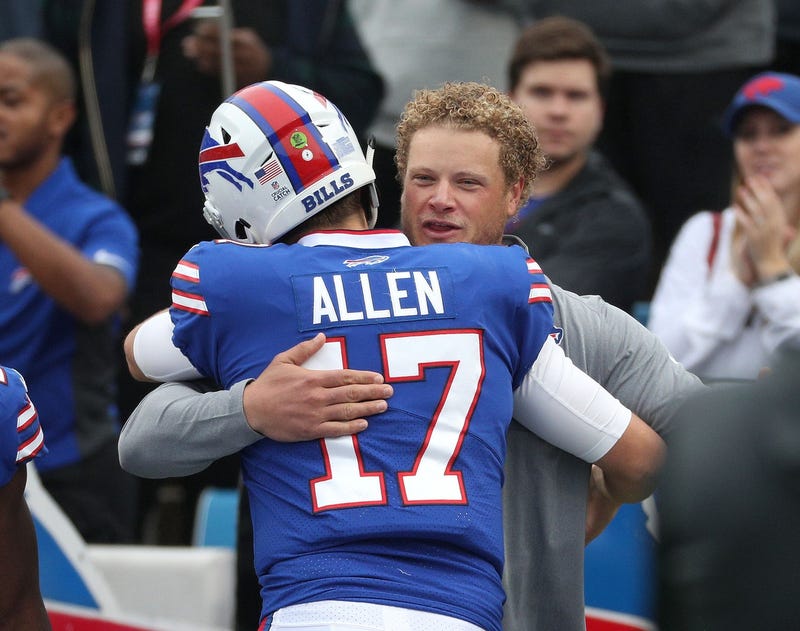 Former Bills center Eric Wood stopped on the field and visit with players including quarterback Josh Allen at a game in the past.
