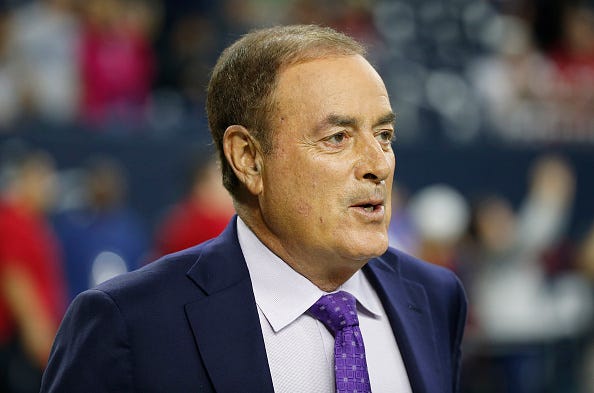 NBC's Al Michaels roams the sideline prior to an NFL game.