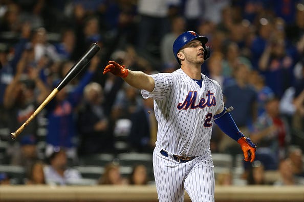 Pete Alonso flips his bat after belting a home run.