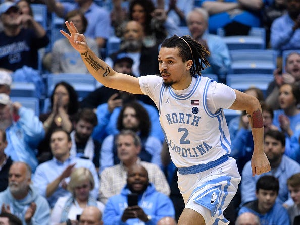 Cole Anthony tosses up three fingers after draining a shot from beyond the arc.