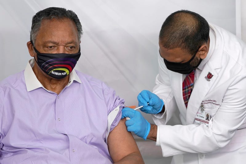 FILE - In this Friday, Jan. 8, 2021 file photo, Rev. Jesse Jackson receives the Pfizer's BioNTech COVID-19 vaccine from Dr. Kiran Chekka, Covid Administration Physician at the Roseland Community Hospital in Chicago. The Rev. Jesse Jackson and his wife, Jacqueline, have been hospitalized after testing positive for COVID-19 according to a statement Saturday, Aug. 21, 2021. He is vaccinated against the virus and publicly received his first dose in January. According to a statement released Saturday evening, the Jacksons are being treated at Northwestern Memorial Hospital in Chicago. He is 79 years old. Jacqueline Jackson is 77.