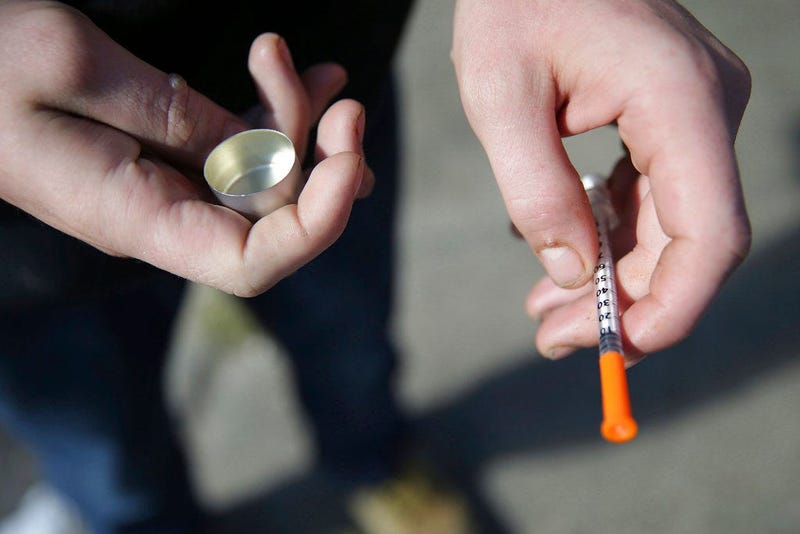 A fentanyl user holds a needle near Kensington and Cambria in Philadelphia. Suicides and drug overdoses helped lead a surge in U.S. deaths last year, and drove a continuing decline in how long Americans are expected to live.