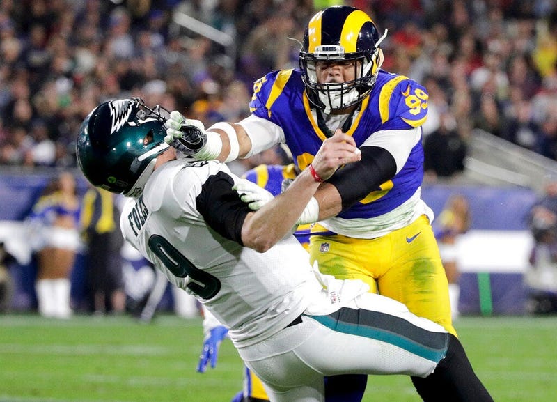 Los Angeles Rams defensive end Aaron Donald hits Philadelphia Eagles quarterback Nick Foles