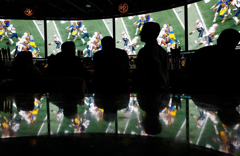 People watch Super Bowl LIII at the Westgate Superbook sports book, Sunday, Feb. 3, 2019, in Las Vegas.