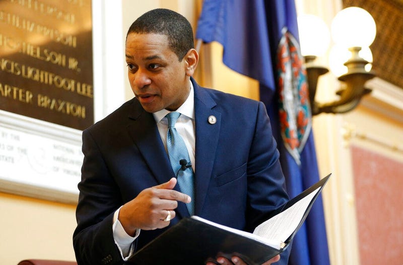 Virginia Lt. Gov Justin Fairfax looks over a briefing book prior to the start of the senate session at the Capitol in Richmond, Va., Thursday, Feb. 7, 2019