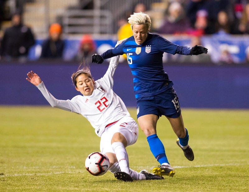 United States' Megan Rapinoe, right, tries to get around Japan's Risa Shimizu, left, with the ball during the first half of SheBelieves Cup soccer match, Wednesday, Feb. 27, 2019, in Chester, Pa