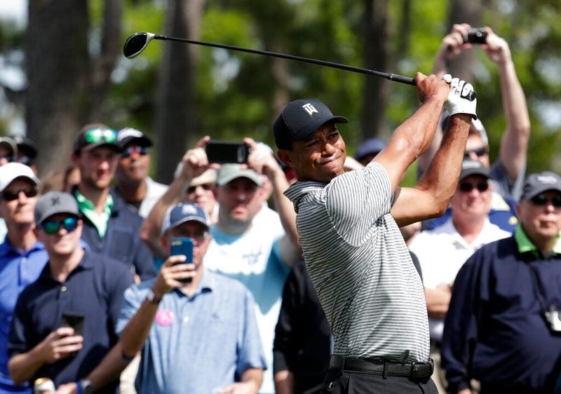 Tiger Woods hits from the seventh tee during a practice round at The Players Championship golf tournament, Wednesday, March 13, 2019, in Ponte Vedra Beach, Fla