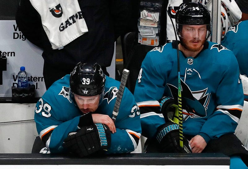 San Jose Sharks' Logan Couture (39) and Gustav Nyquist (14) react on the bench as the St. Louis Blues take a 5-0 lead in the third period in Game 5 of the NHL hockey Stanley Cup Western Conference finals in San Jose, Calif., on Sunday, May 19, 2019.