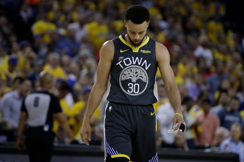 Golden State Warriors' Stephen Curry walks on the court during a timeout in the second quarter of Game 6 of basketball's NBA Finals against the Toronto Raptors Thursday, June 13, 2019, in Oakland, Calif. (AP Photo/Ben Margot)