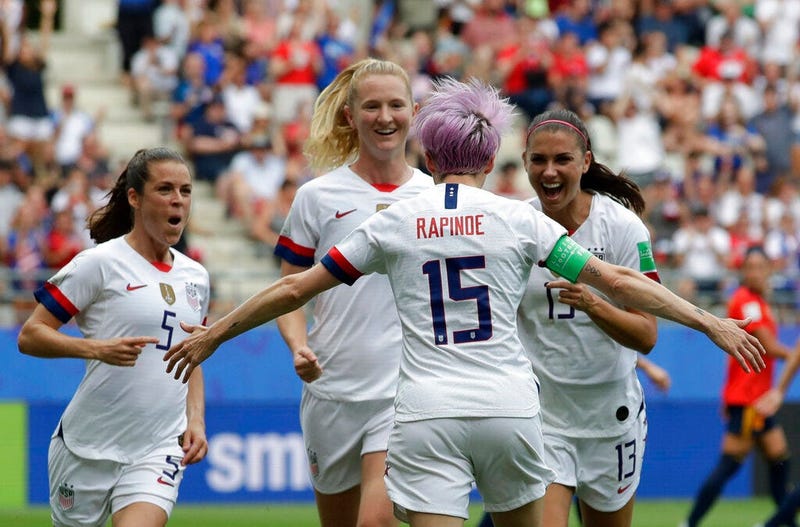 United States' Megan Rapinoe, front, celebrates with teammates after scoring the opening goal from a penalty kick during the Women's World Cup round of 16 soccer match between Spain and US at the Stade Auguste-Delaune in Reims, France, Monday, June 24, 20