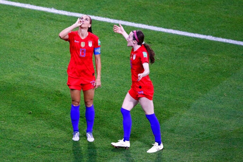 United States' Alex Morgan, left, celebrates her side's second goal during the Women's World Cup semifinal soccer match between England and the United States, at the Stade de Lyon outside Lyon, France, Tuesday, July 2, 2019.