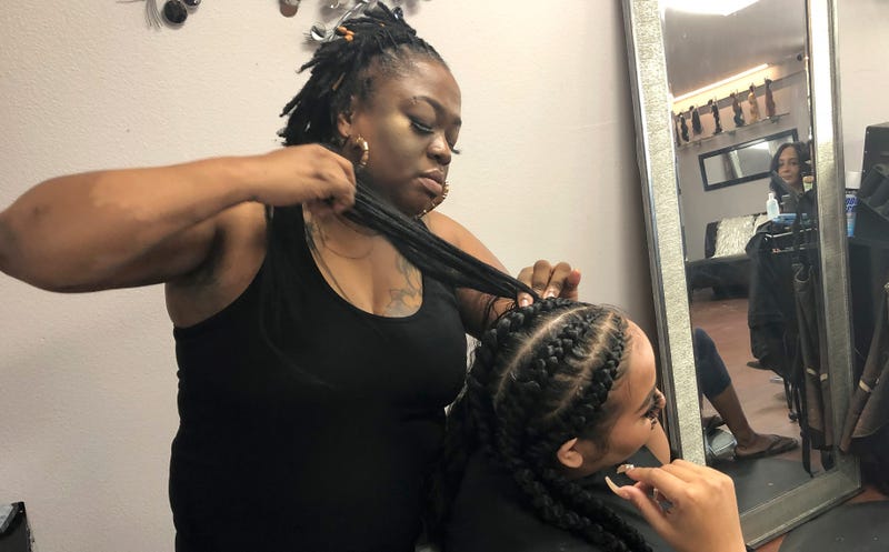 California is the first state to ban job and school discrimination against people for wearing natural hair styles such as braids.
