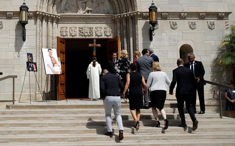 Members of Los Angeles Angels pitcher Tyler Skaggs' family hold hands as the walk into the St. Monica Catholic Church for a memorial service in his honor Monday, July 22, 2019, in Los Angeles.