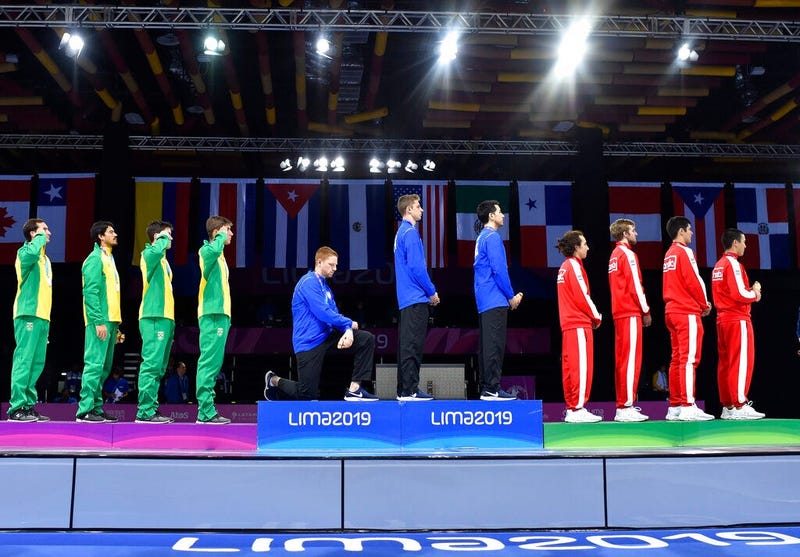 Race Imboden of the United States takes a knee