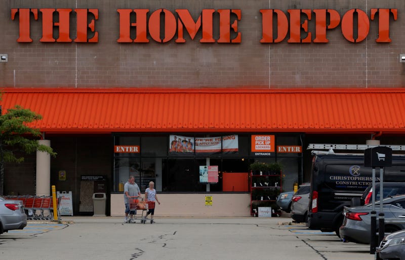 Shoppers leave the Home Depot store in Manchester, N.H., Thursday, Aug. 15, 2019.
