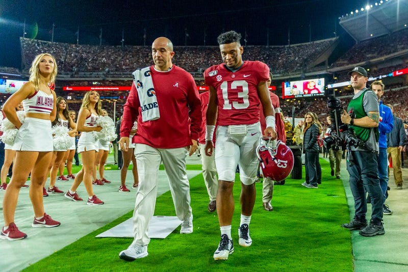Alabama quarterback Tua Tagovailoa (13) walks off the field hurt against Tennessee during the first half of an NCAA college football game, Saturday, Oct. 19, 2019, in Tuscaloosa, Ala.