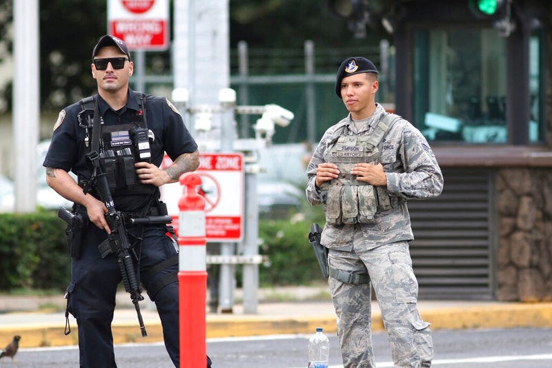 Security stands guard outside the main gate at Joint Base Pearl Harbor-Hickam