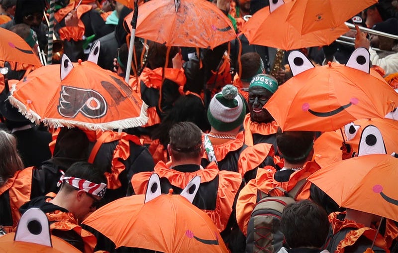 Members of the Froggy Carr club march during the Mummers Parade.