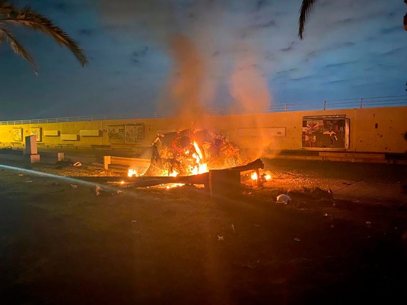 A burning vehicle is shown at Baghdad International Airport following an airstrike, in Baghdad, Iraq, early Friday, Jan. 3, 2020.