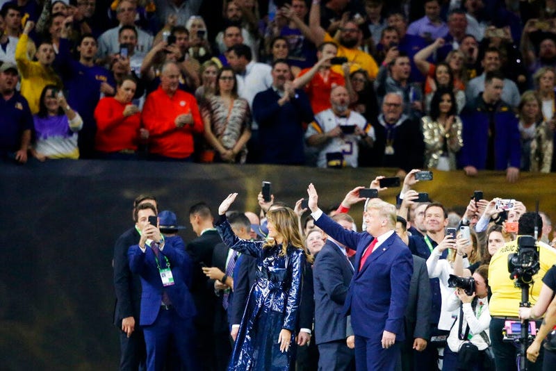 President Donald Trump and first lady Melania Trump arrive for the College Football Playoff National Championship game between LSU and Clemson, Monday, Jan. 13, 2020, in New Orleans.