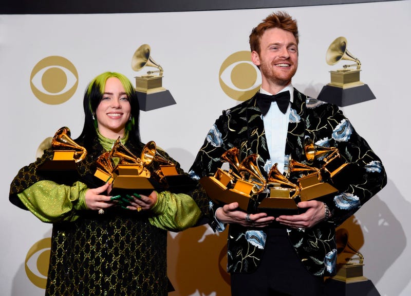 From left: Billie Eilish and Finneas O'Connell pose in the press room with the awards for best album, best engineered album, best pop vocal album, best song, best record, best new artist and best producer, non-classical, at the 62nd annual Grammy Awards.