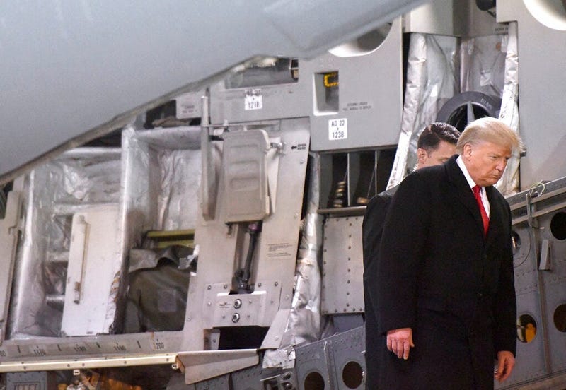 President Donald Trump disembarks a C-17 aircraft after a prayer for Sgt. 1st Class Javier Jaguar Gutierrez and Sgt. 1st Class Antonio Rey Rodriguez