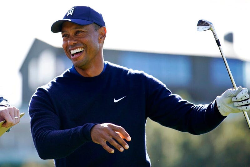 Tiger Woods smiles after hitting his tee shot on the 16th hole during the Genesis Invitational pro-am golf event at Riviera Country Club, Wednesday, Feb. 12, 2020, in the Pacific Palisades area of Los Angeles.
