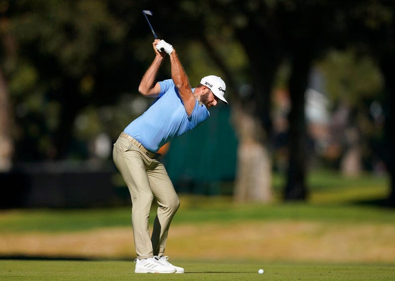 Dustin Johnson hits his second shot on the 11th hole during the second round of the Genesis Invitational golf tournament at Riviera Country Club, Friday, Feb. 14, 2020, in the Pacific Palisades area of Los Angeles
