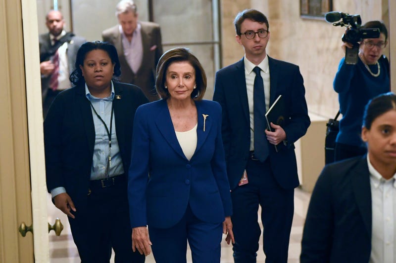 In this Friday, March 27, 2020 file photo, House Speaker Nancy Pelosi, D-Calif., arrives on Capitol Hill in Washington.