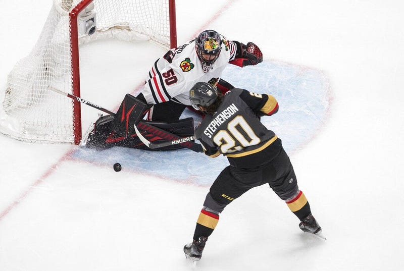 Vegas Golden Knights' Chandler Stephenson (20) is stopped by Chicago Blackhawks goalie Corey Crawford (50) during the second period in Game 5 of an NHL hockey first-round playoff series, Tuesday, Aug. 18, 2020, in Edmonton, Alberta
