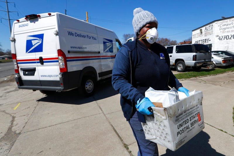 United States Postal Service worker makes a delivery