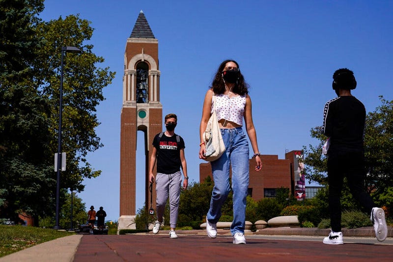 Masked students walk through the campus of Ball State University in Muncie, Indiana (AP)