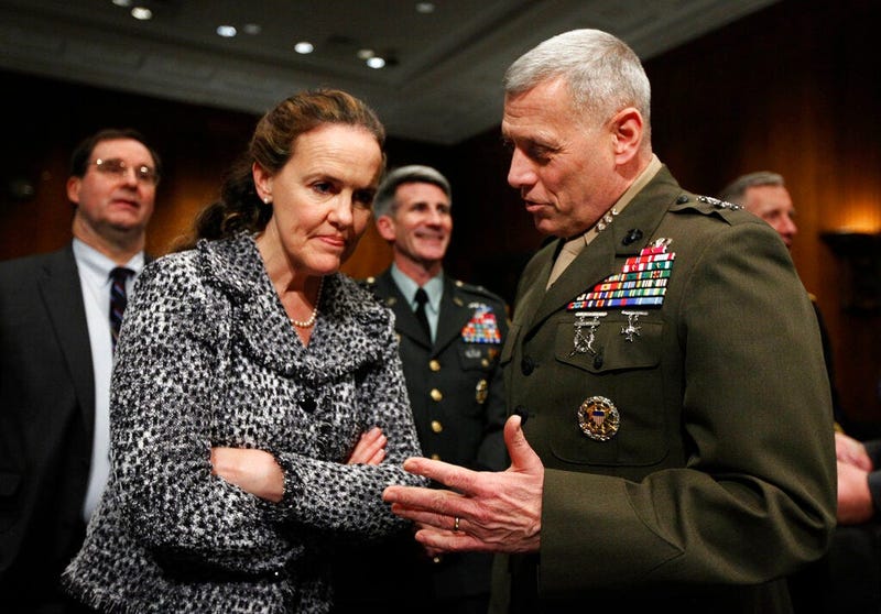 In this Feb. 22, 2010, file photo then-Defense Undersecretary for Policy Michele Flournoy, left, talks with Marines Lt. Gen. John Paxton