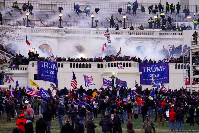 In this Wednesday, Jan. 6, 2021, file photo, violent protesters, loyal to President Donald Trump, storm the Capitol, in Washington. (AP Photo/John Minchillo, File)