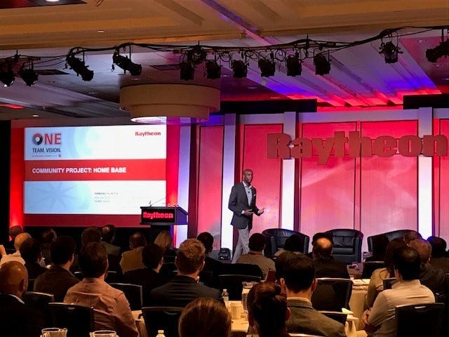 Home Base Program's Armand Hunter speaks to Raytheon employees about the program