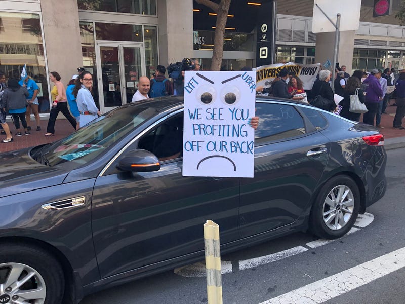 Hundreds of Uber and Lyft drivers rallied in San Francisco on Aug. 27, 2019, demanding that the ride-hail companies grant them the status of employees rather than independent contractors who lack benefits.