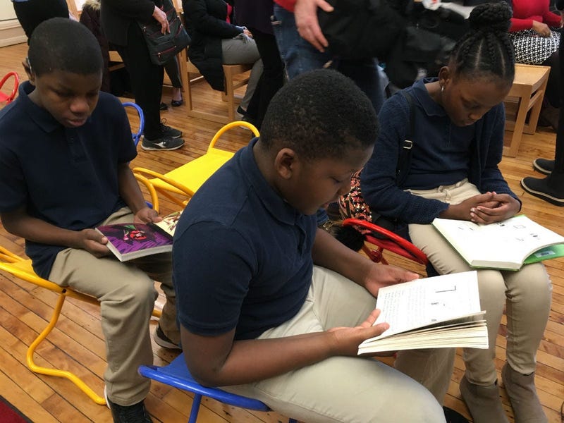 Students read at the re-opened library at Bache-Martin Elementary in Fairmount.