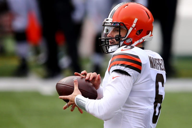 Cleveland Browns quarterback Baker Mayfield takes the snap and looks to pass during the first quarter of a Week 7 NFL football game against the Cincinnati Bengals, Sunday, Oct. 25, 2020, at Paul Brown Stadium in Cincinnati.