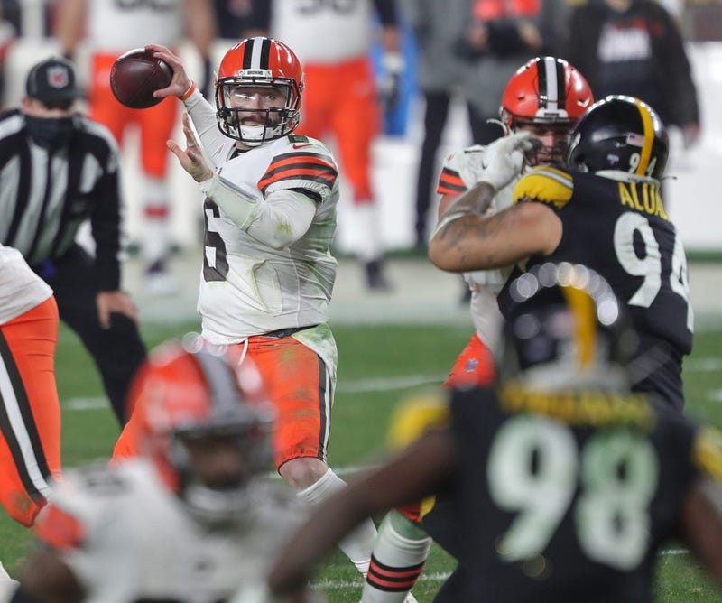 Cleveland Browns quarterback Baker Mayfield looks to make a pass during the second half of an NFL wild-card playoff football game, Sunday, Jan. 10, 2021, in Pittsburgh, Pennsylvania.