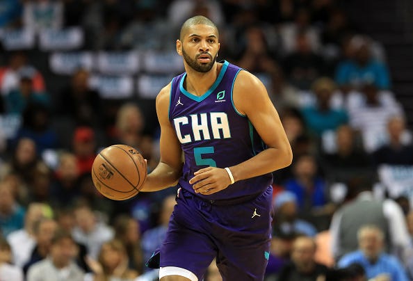 Hornets' Nicolas Batum dribbles up court.