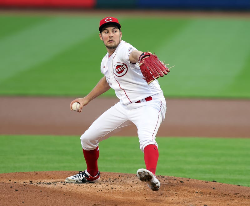 Trevor Bauer pitches for the Reds