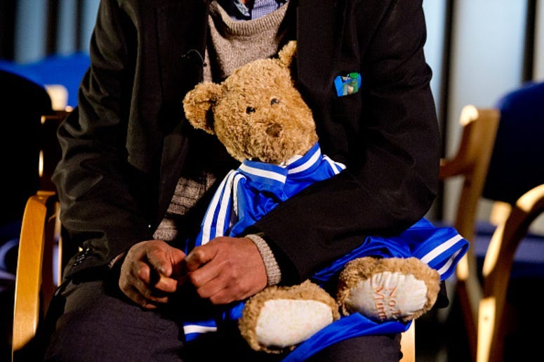 Father holds a bear