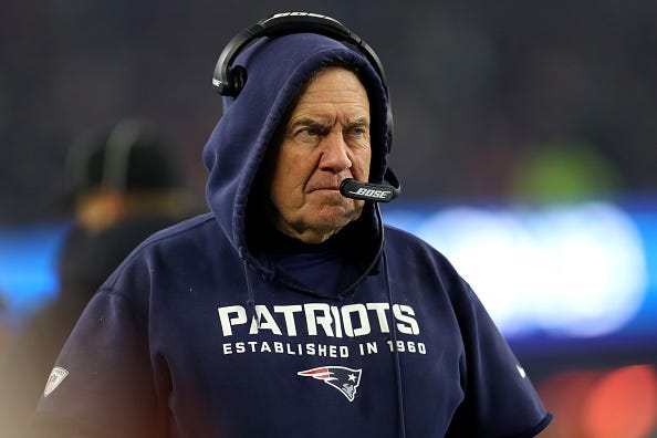 Bill Belichick shoots a glare across the field from the Patriots sideline.