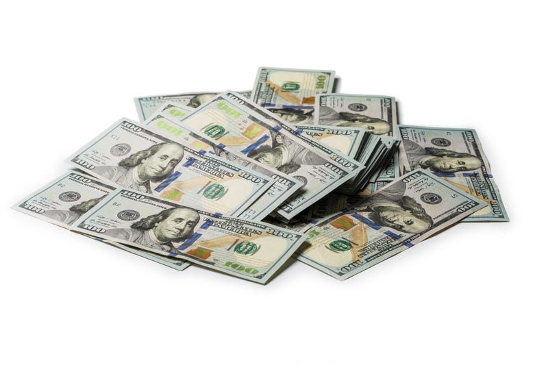 Bundle of US 100 dollars bank notes isolated on white background