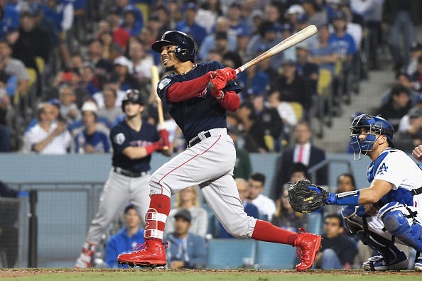 Mookie Betts rips a fly ball against the Dodgers in the World Series.