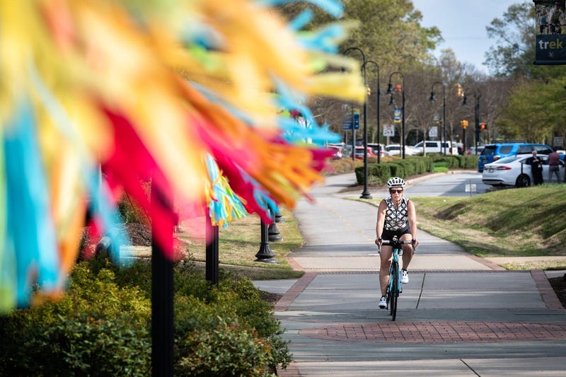 Woman Bikes in Travelers Rest