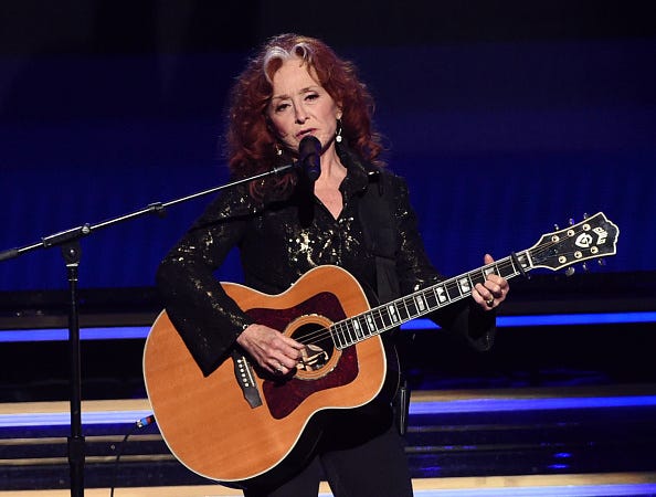 Bonnie Raitt with Guild acoustic guitar