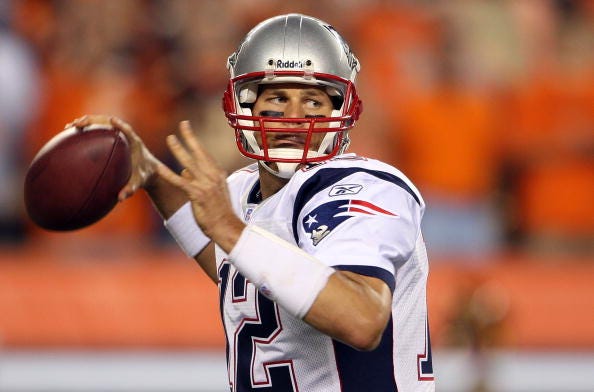 Tom Brady looks for a receiver down field in a 2007 game with the Patriots.