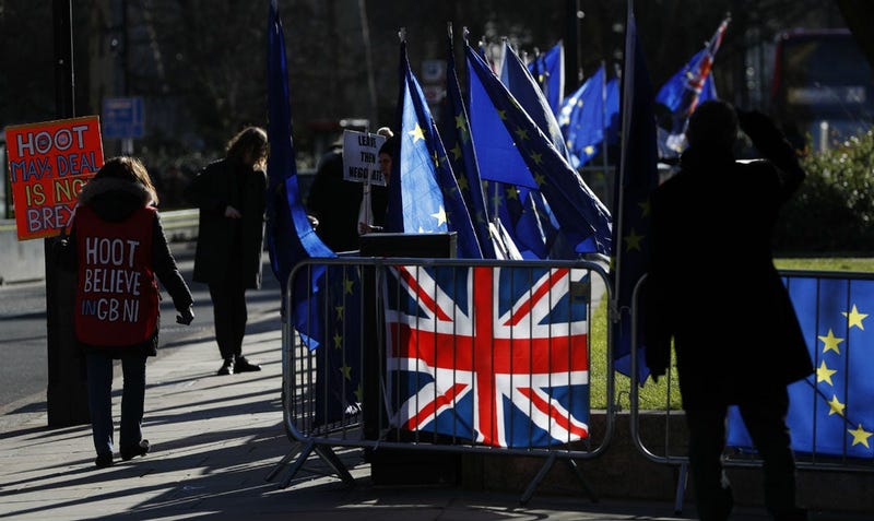 Pro and Anti Brexit protesters demonstrate outside the Houses of Parliament in London, Monday, Jan. 28, 2019.